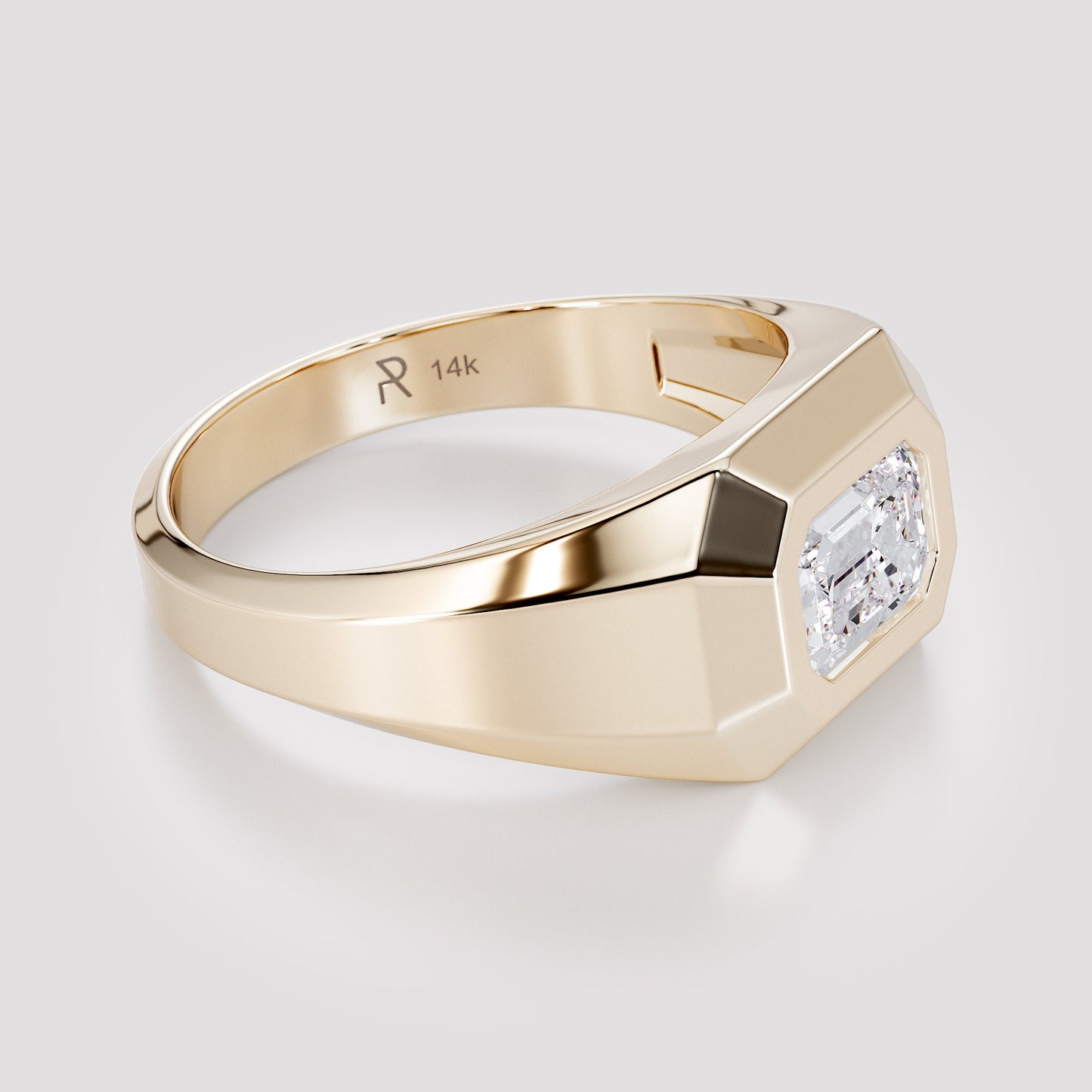 Solid 14K gold men’s signet ring with an emerald-cut white diamond, shown from a side angle on a light gray background.