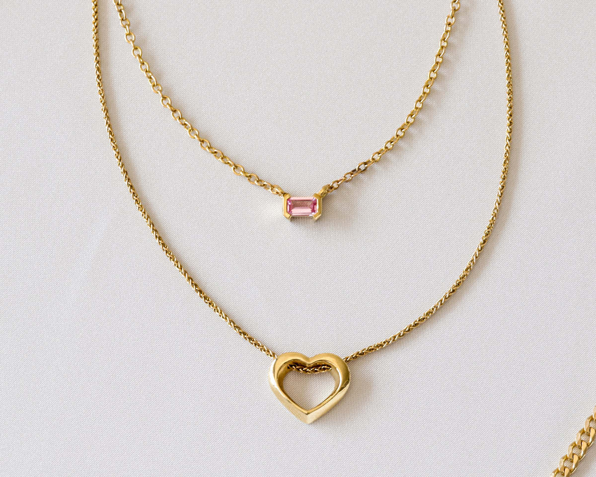 Pink sapphire necklace layered with a fine 14K gold chain
