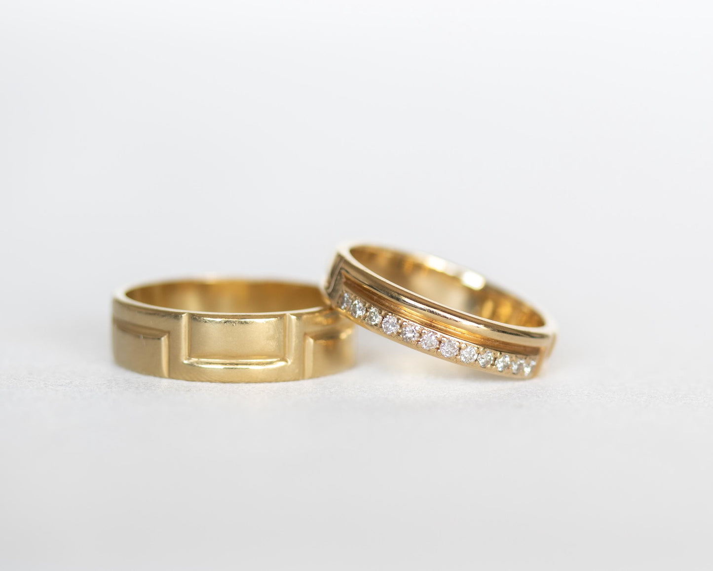 two gold diamond rings side by side