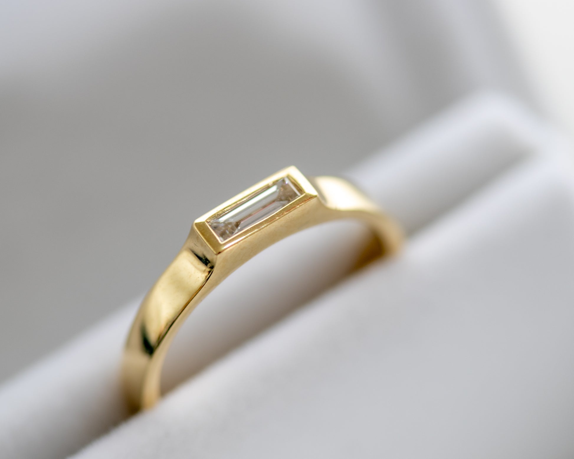 14K gold bezel-set baguette diamond ring in jewelry box