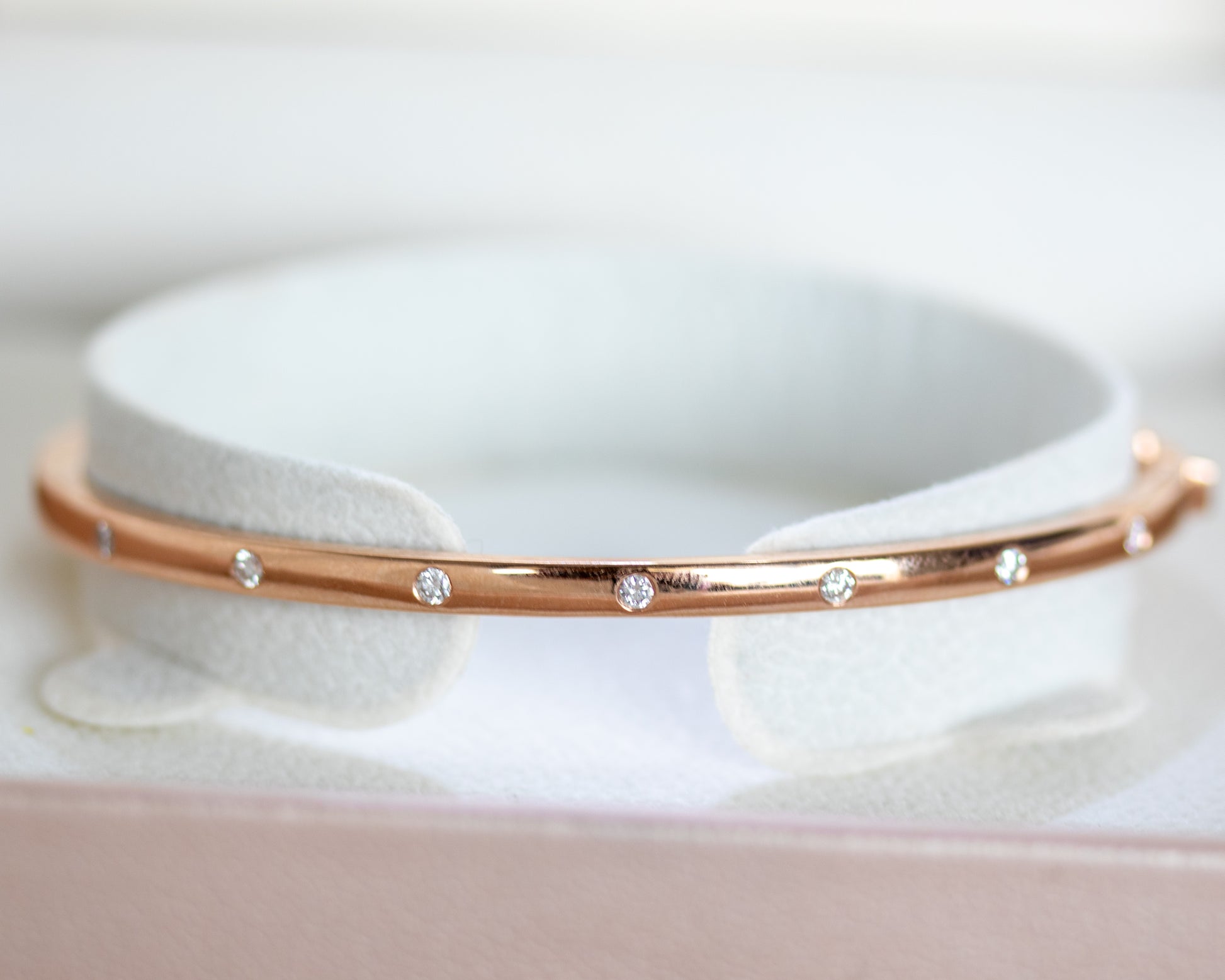 14K gold flush-set diamond bangle in jewelry box packaging