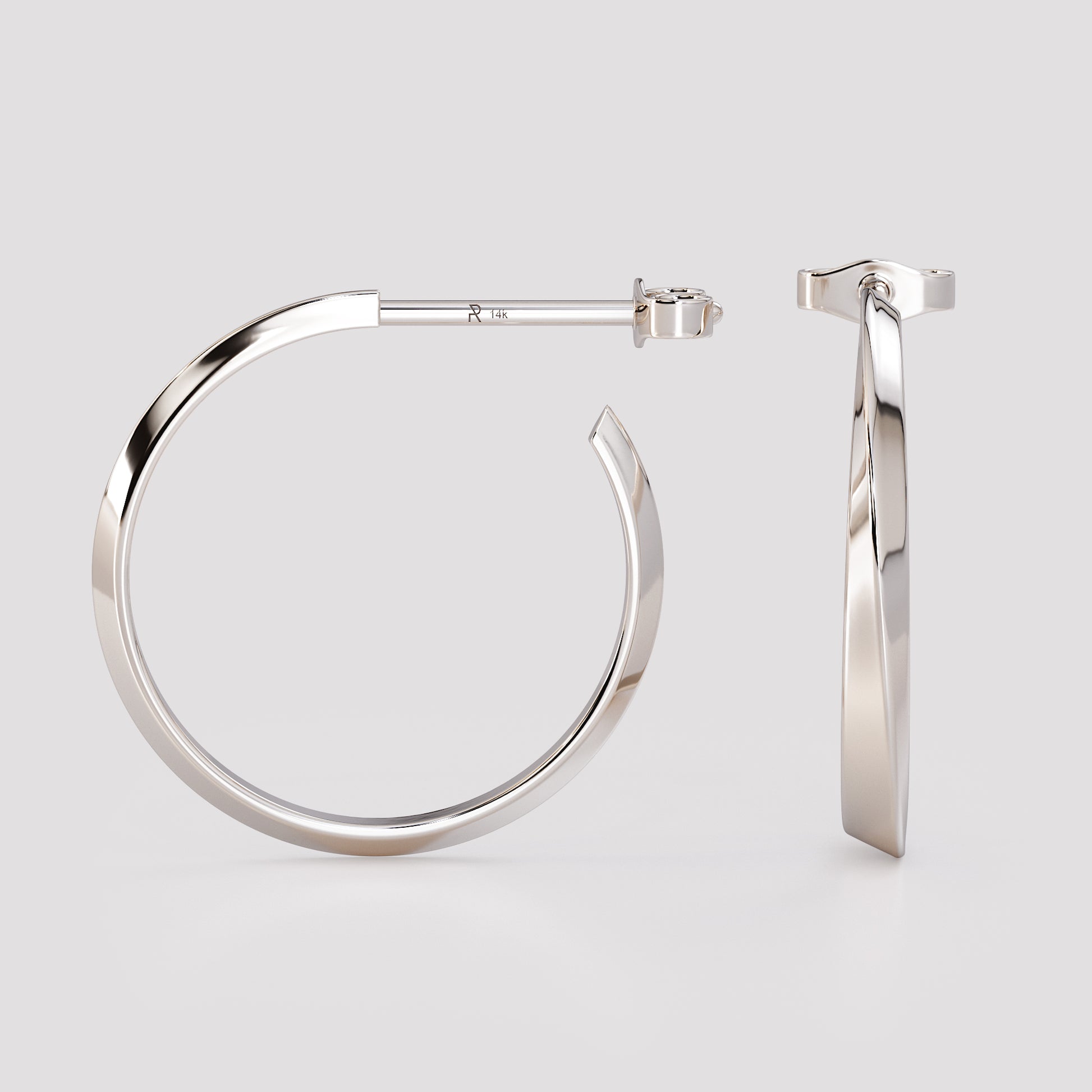 Side and front view of 14K white gold twist hoop earrings, modern geometric sculpted design from the Twist collection, minimalist fine jewelry on light gray background.