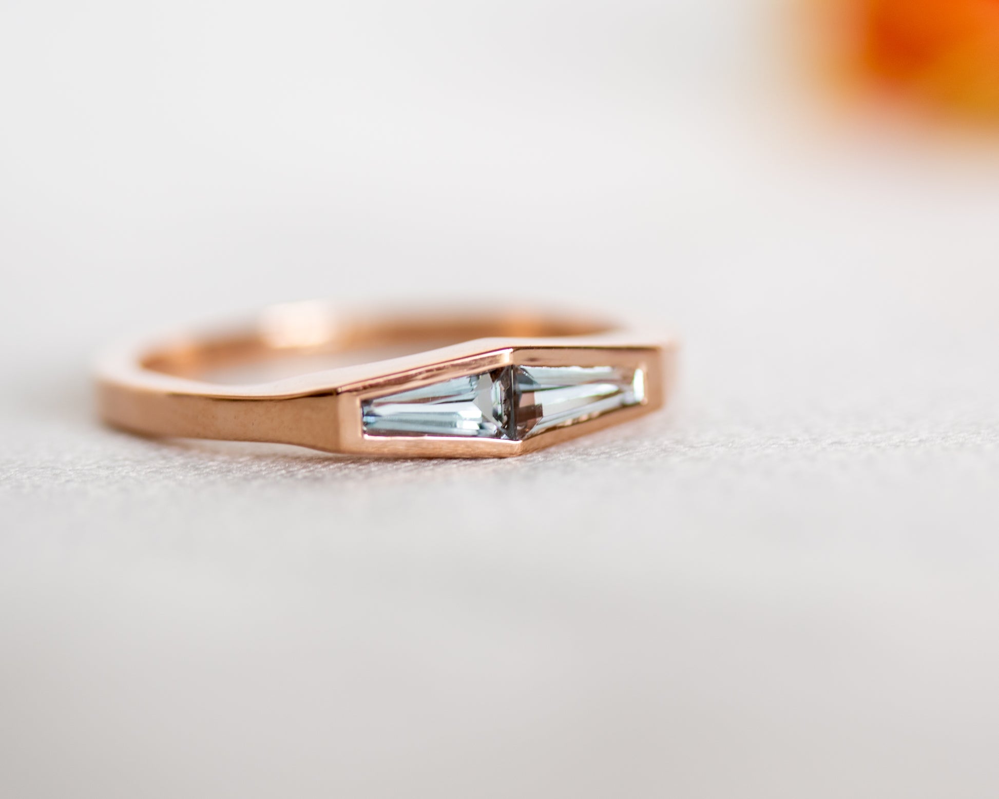 Natural aquamarine two-stone ring in 14K rose gold, side profile of the band