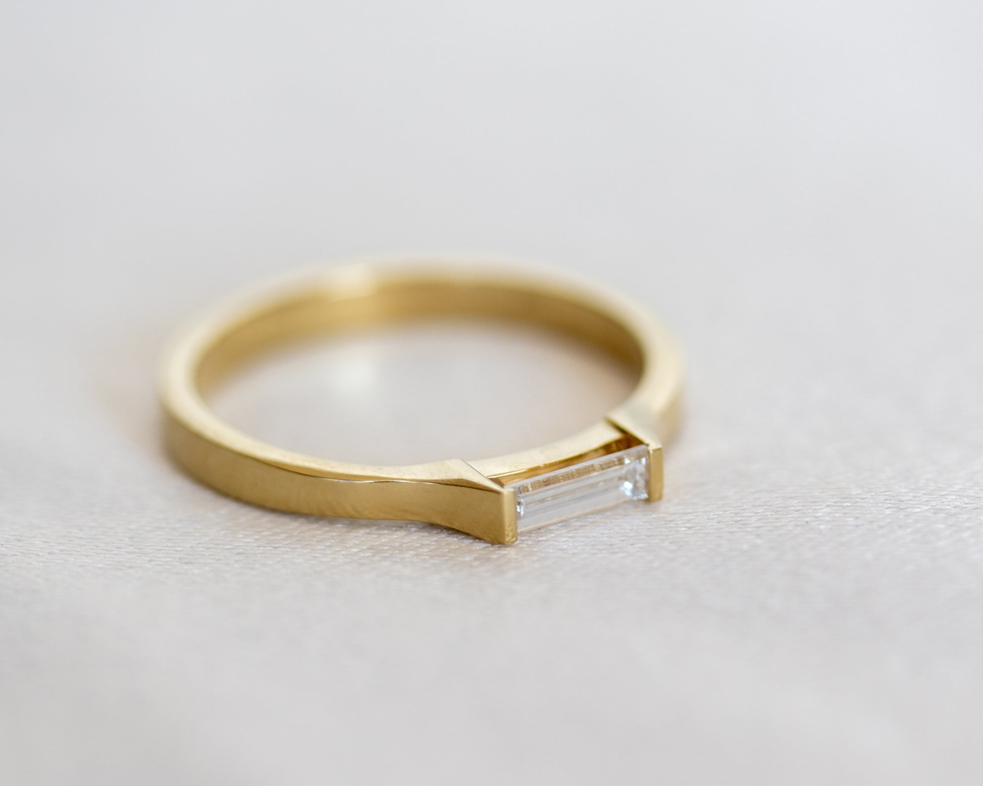 14K gold baguette diamond ring, three-quarter view