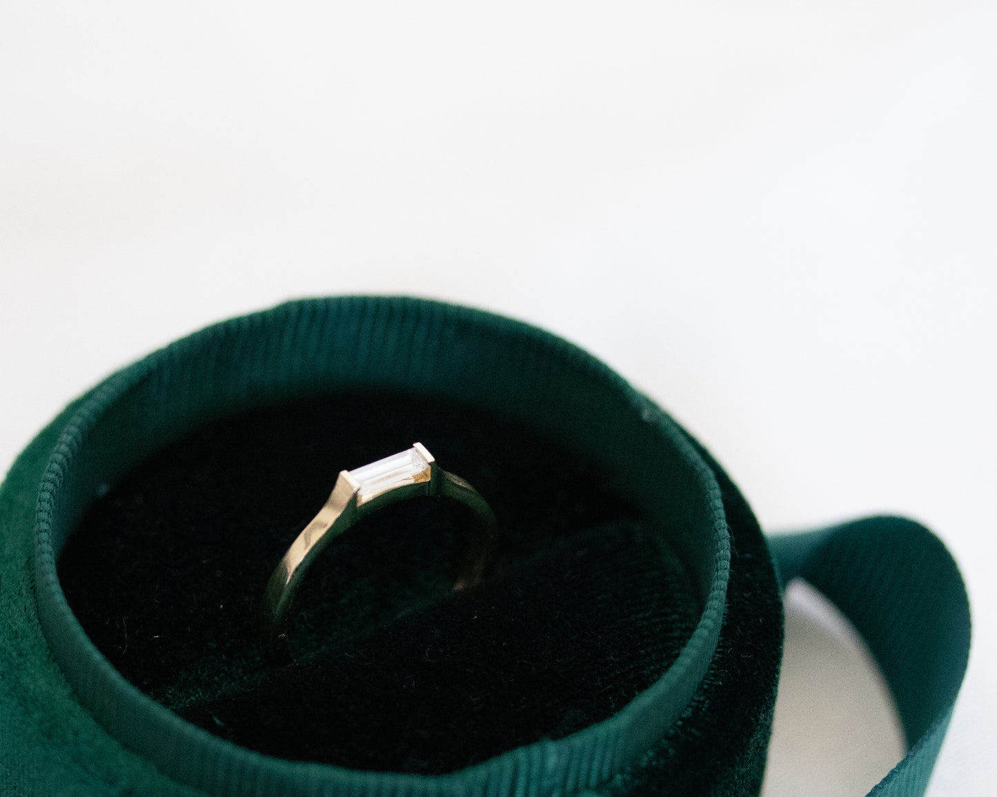 14K gold baguette diamond ring in a velvet box