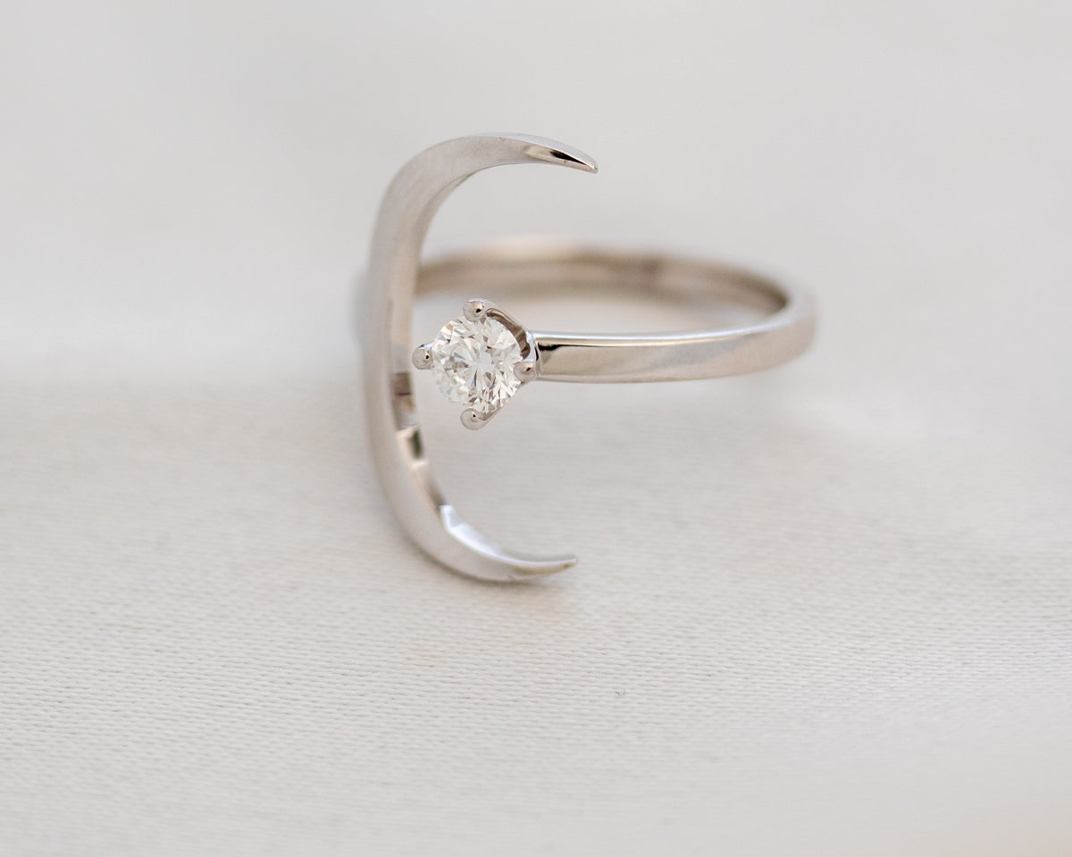 White gold crescent moon diamond ring, side view