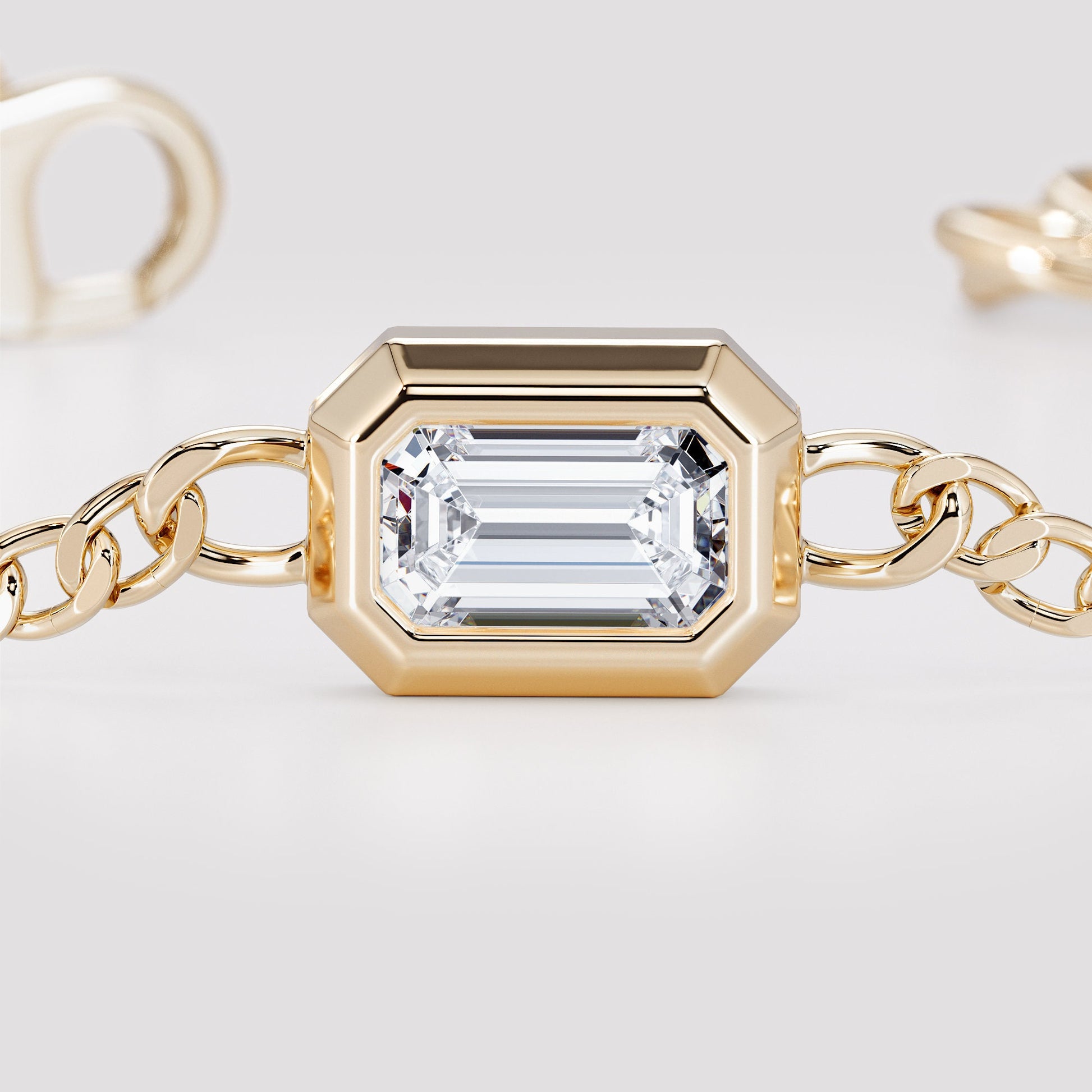 14K yellow gold curb chain bracelet with emerald cut diamond, close-up detail