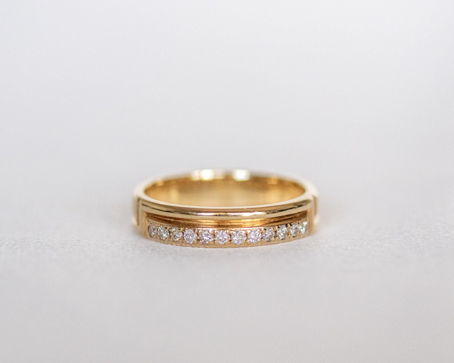 diamond row carved gold band side view