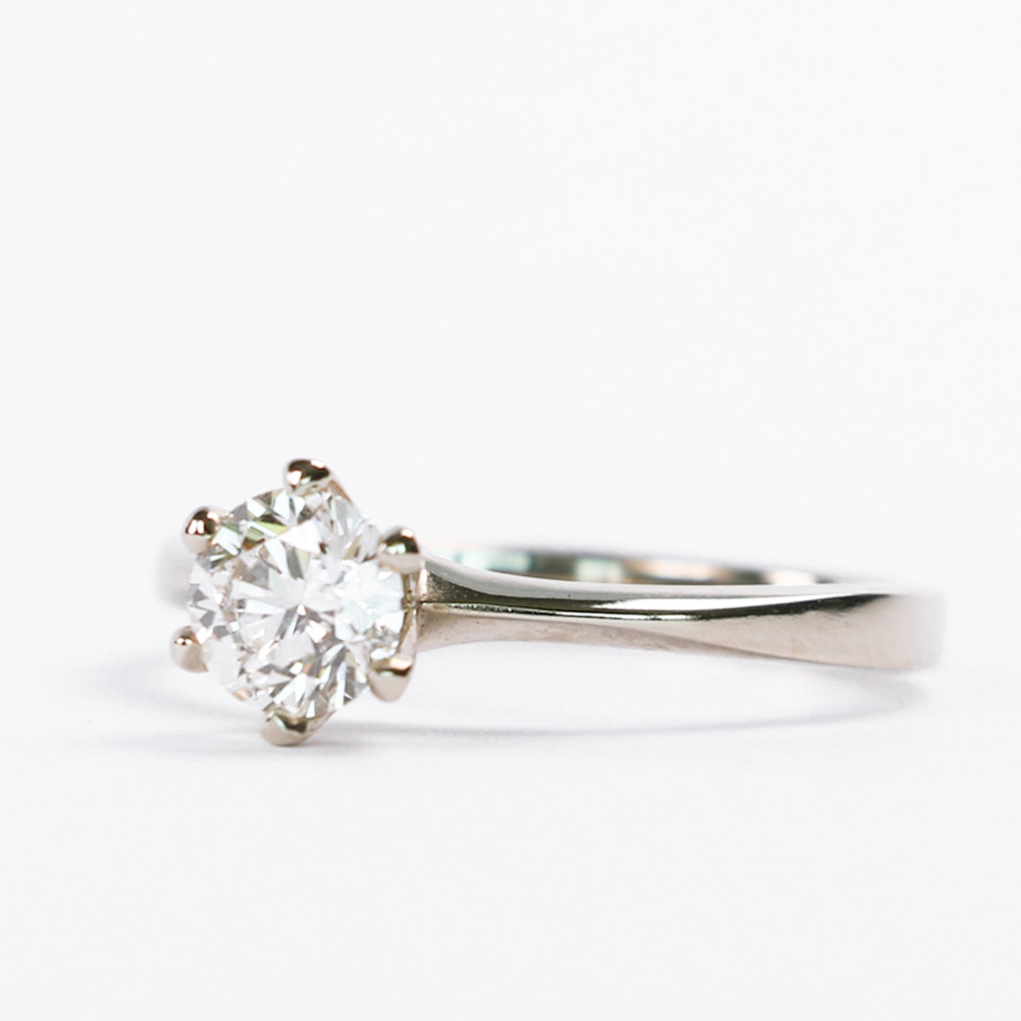 classic diamond engagement ring on white background