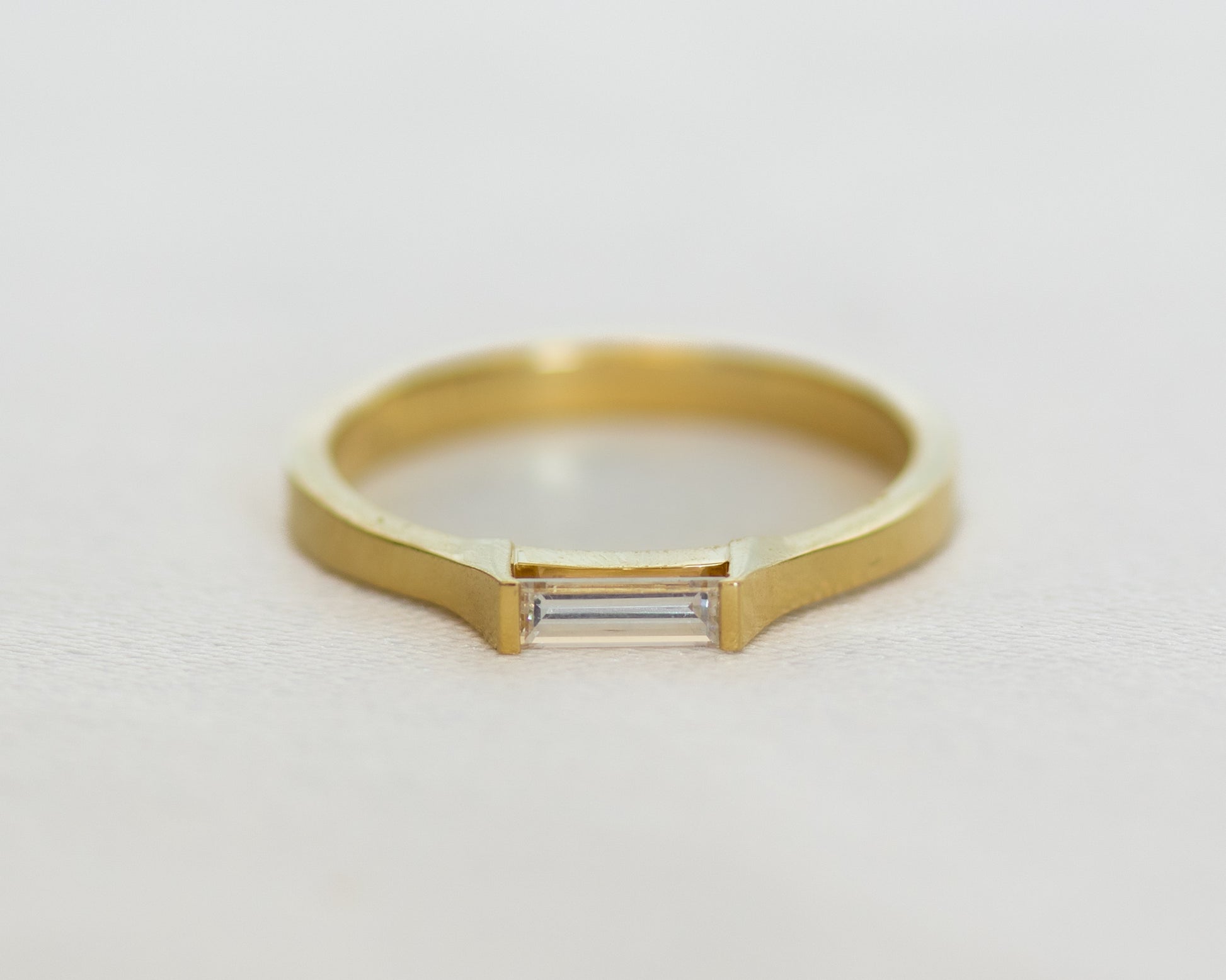 East-west baguette diamond ring, angled view