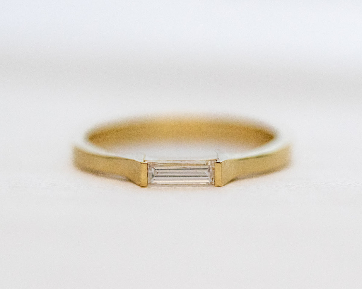 East-west elongated baguette diamond ring in 14K gold
