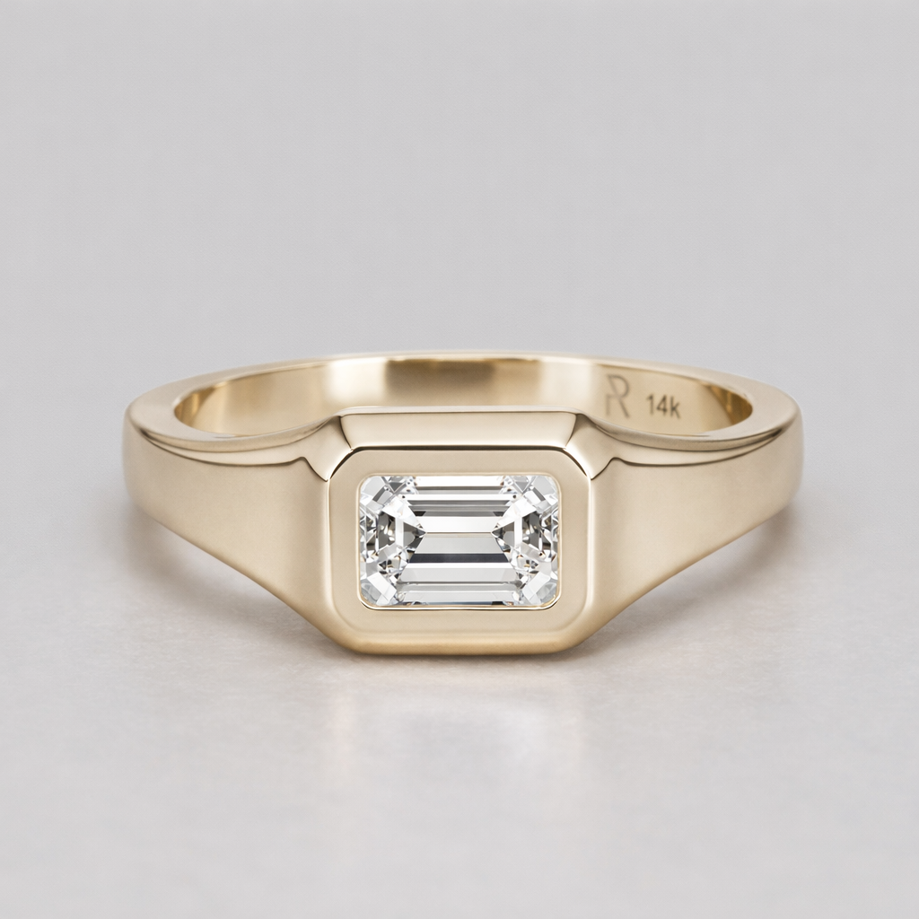 Gold signet ring with east-west emerald-cut diamond