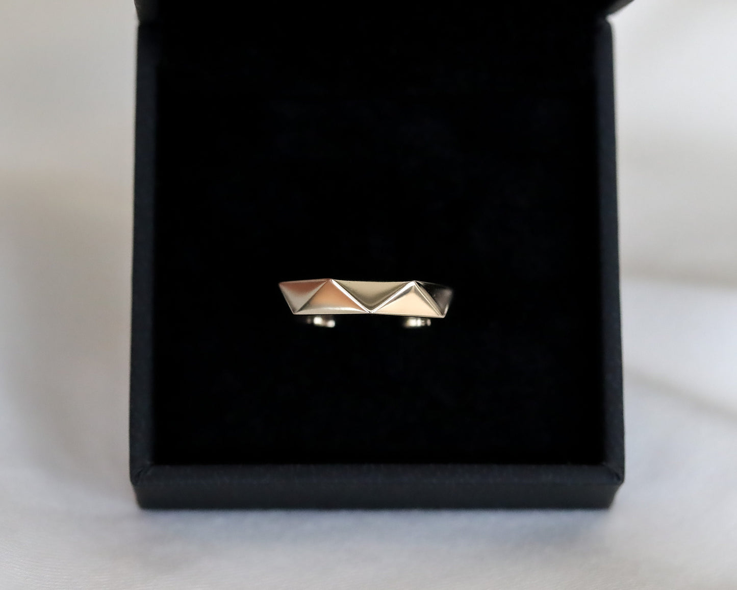 gold ring inside black velvet jewelry box