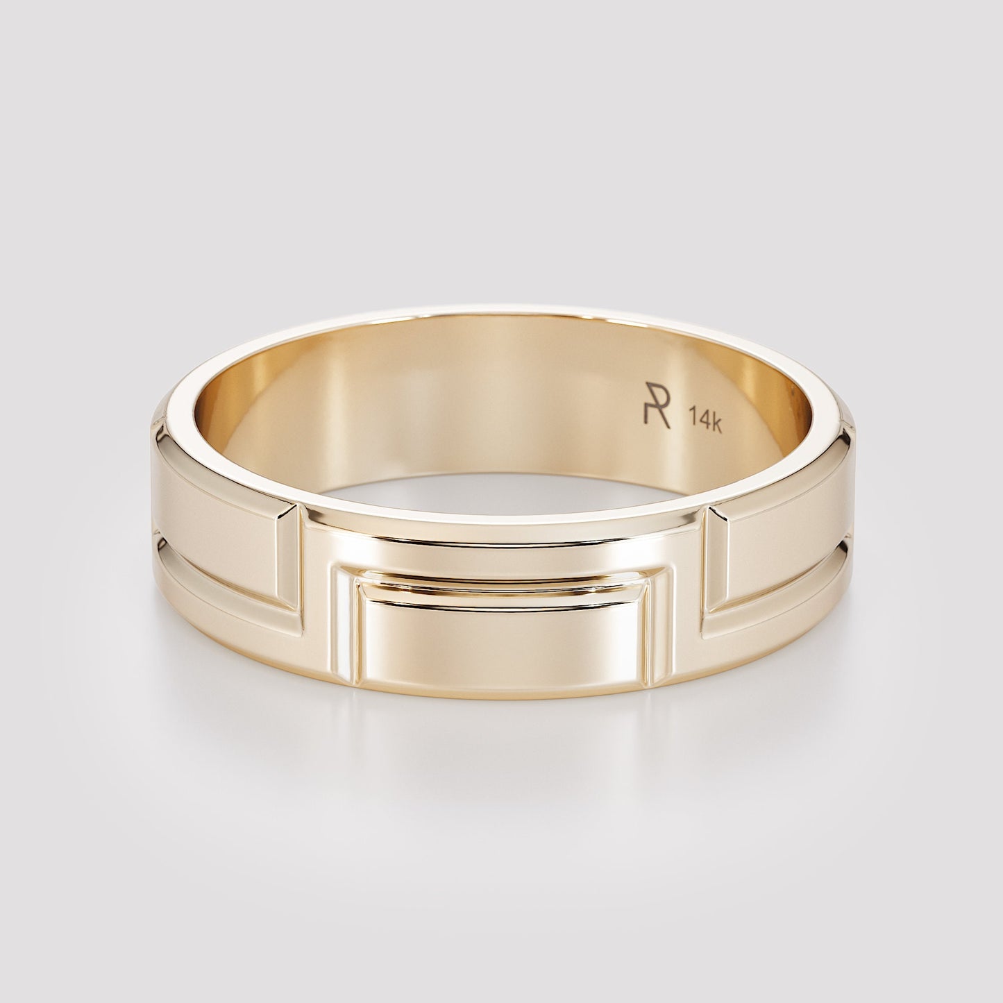 hand wearing carved gold band close up