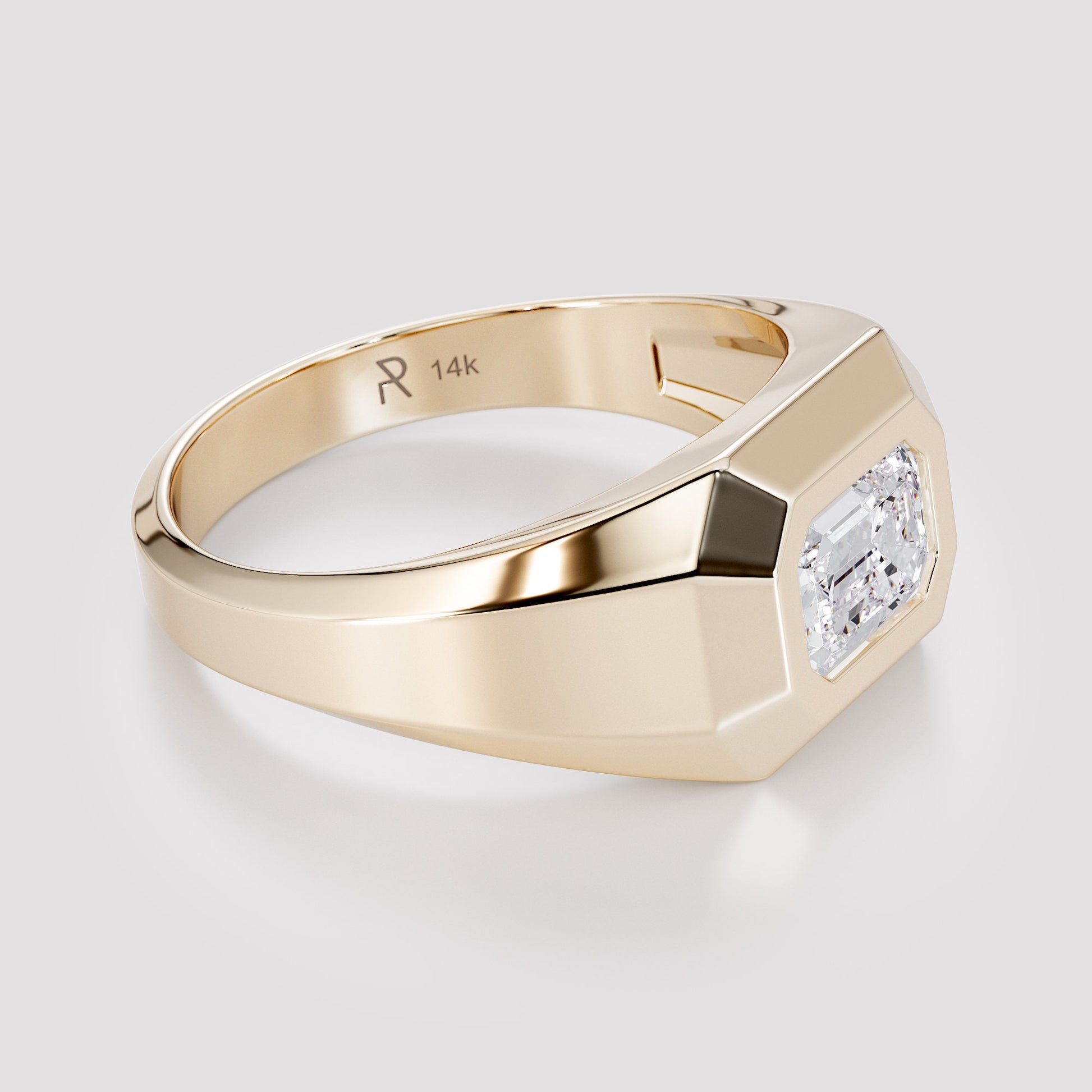 Solid 14K gold men’s signet ring with an emerald-cut white diamond, shown from a side angle on a light gray background.