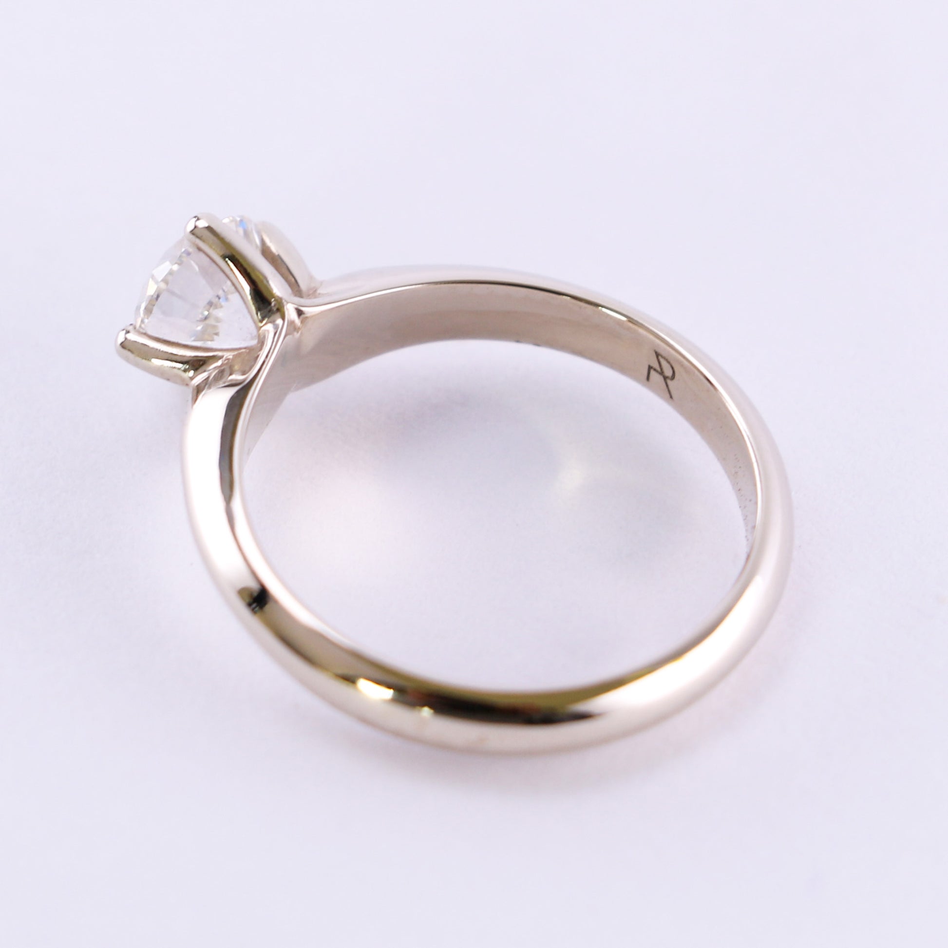 top view of white gold ring set with diamond