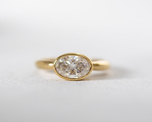 Oval diamond solitaire engagement ring in solid 14K yellow gold, bezel-set design by Rotem Avitan Jewelry — fine handmade gold ring.