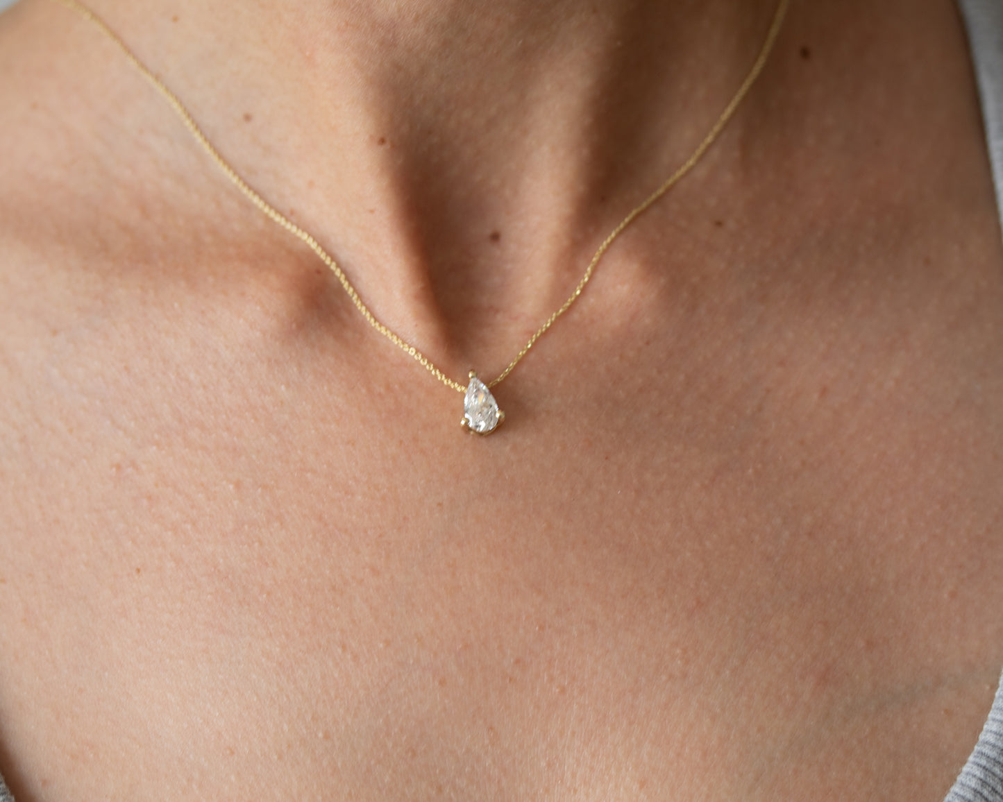 natural pear diamond necklace worn on neck 14K yellow gold