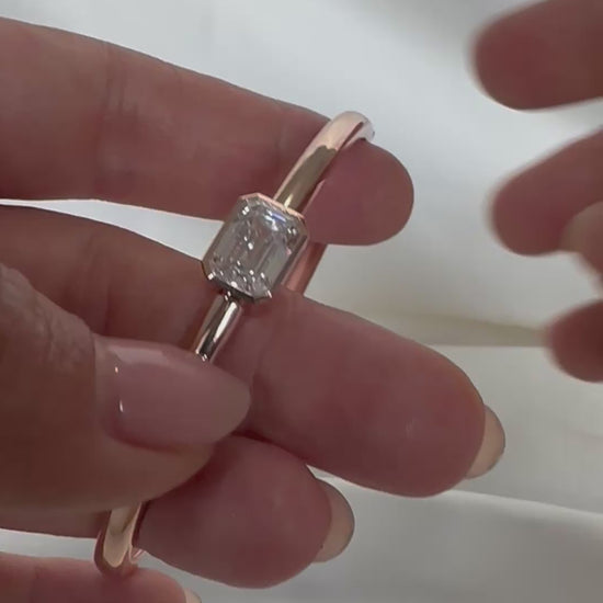  14K gold emerald cut diamond bangle — clasp and hinge mechanism in motion