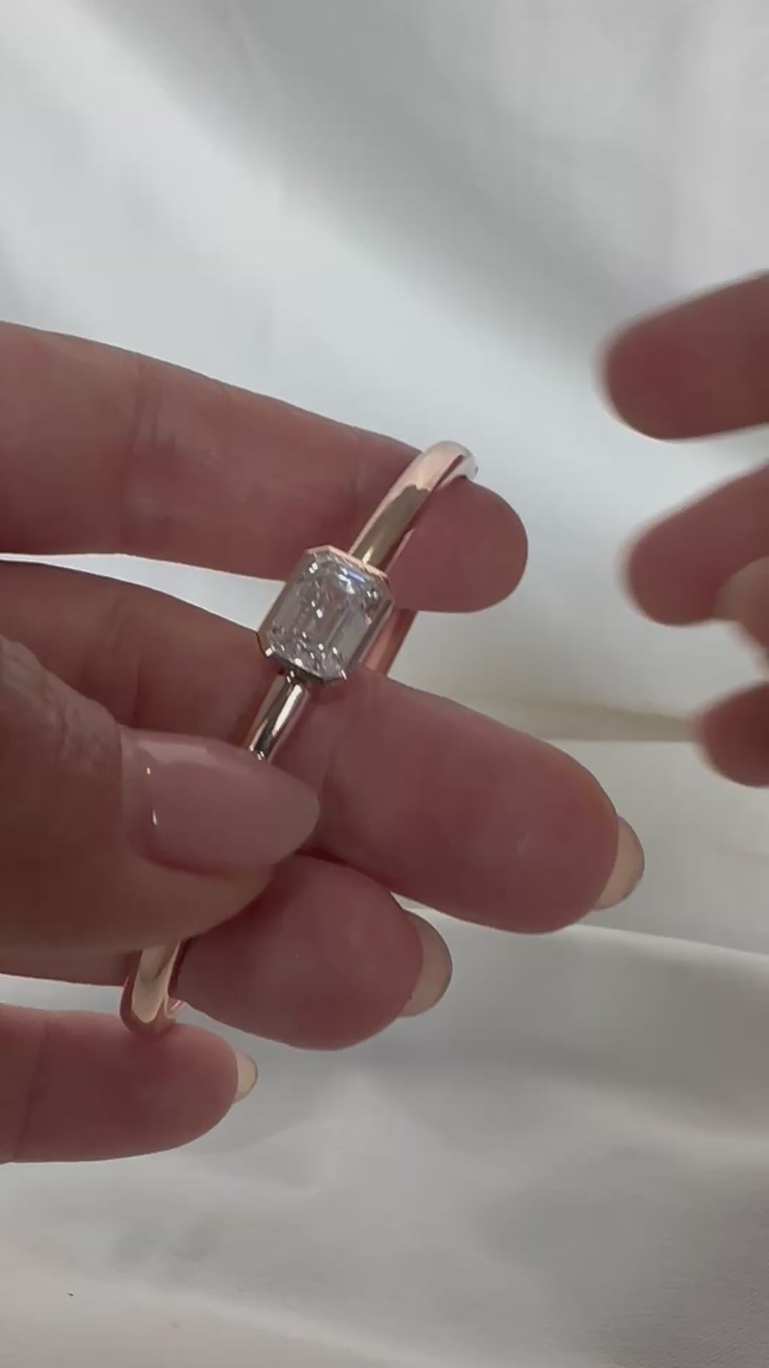  14K gold emerald cut diamond bangle — clasp and hinge mechanism in motion