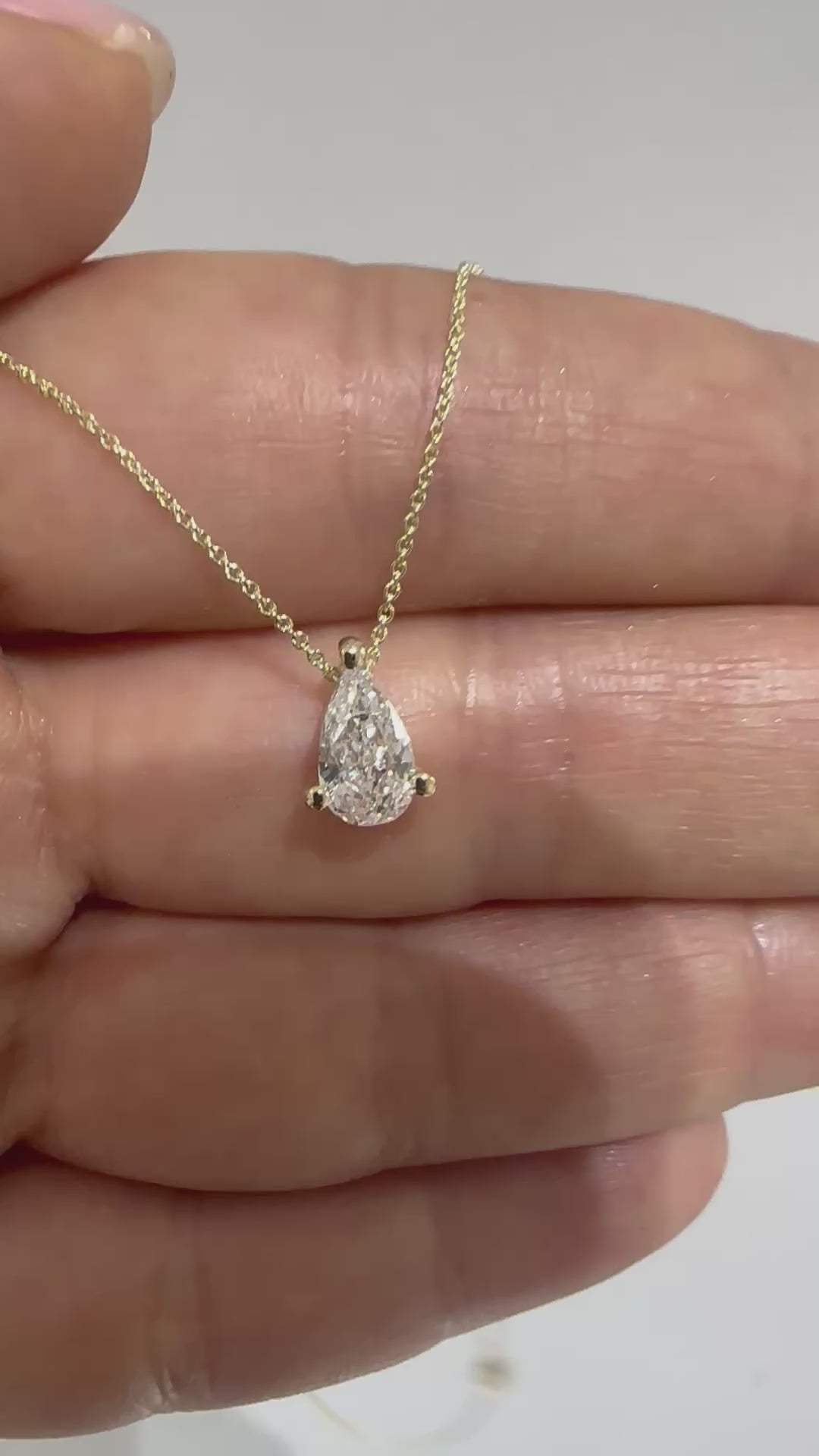 pear diamond pendant 14K gold chain natural diamond
File: pear-diamond-necklace-14k-gold-video