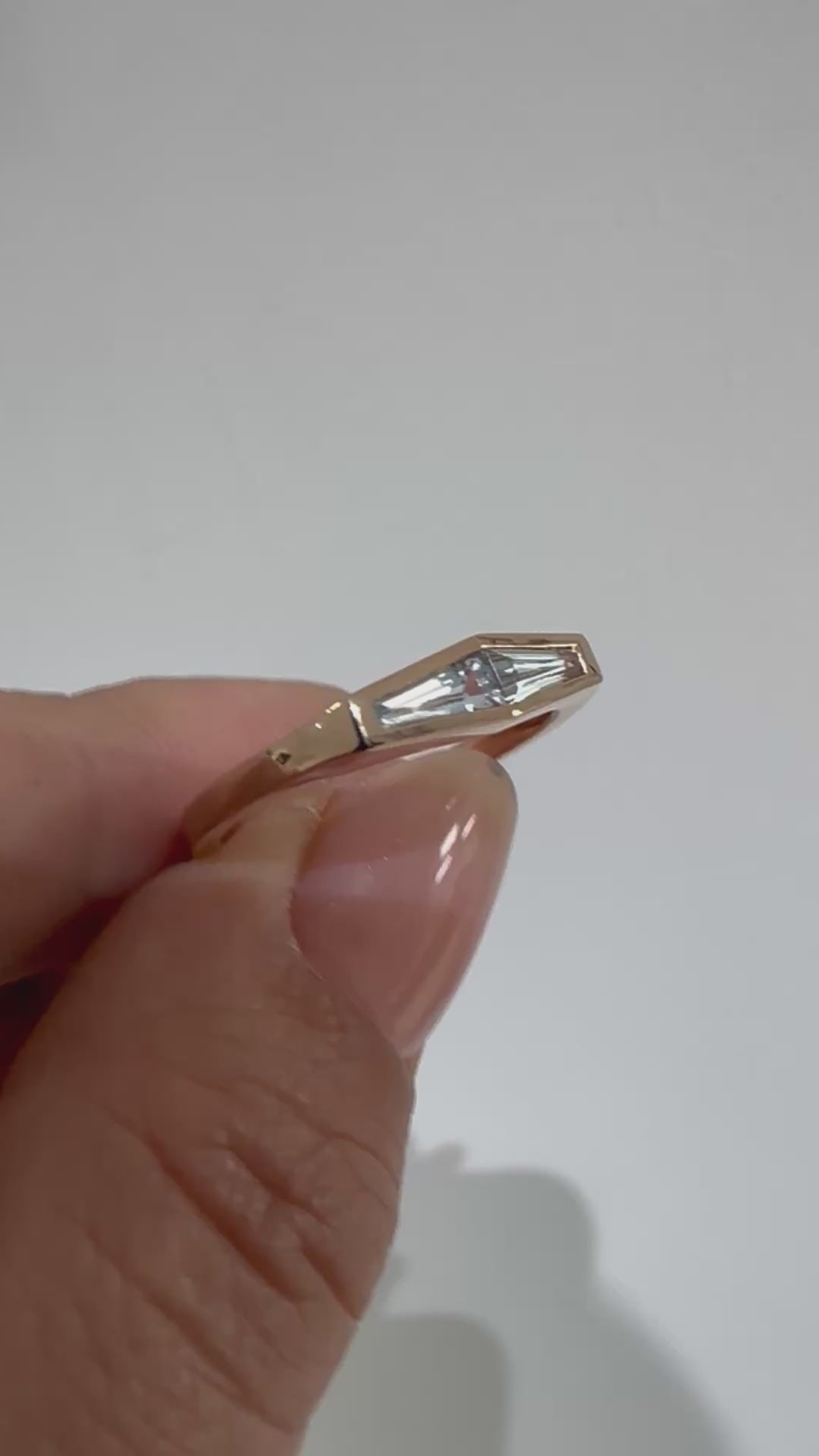 Video of a two-stone aquamarine ring in 14K rose gold shown in women's hand