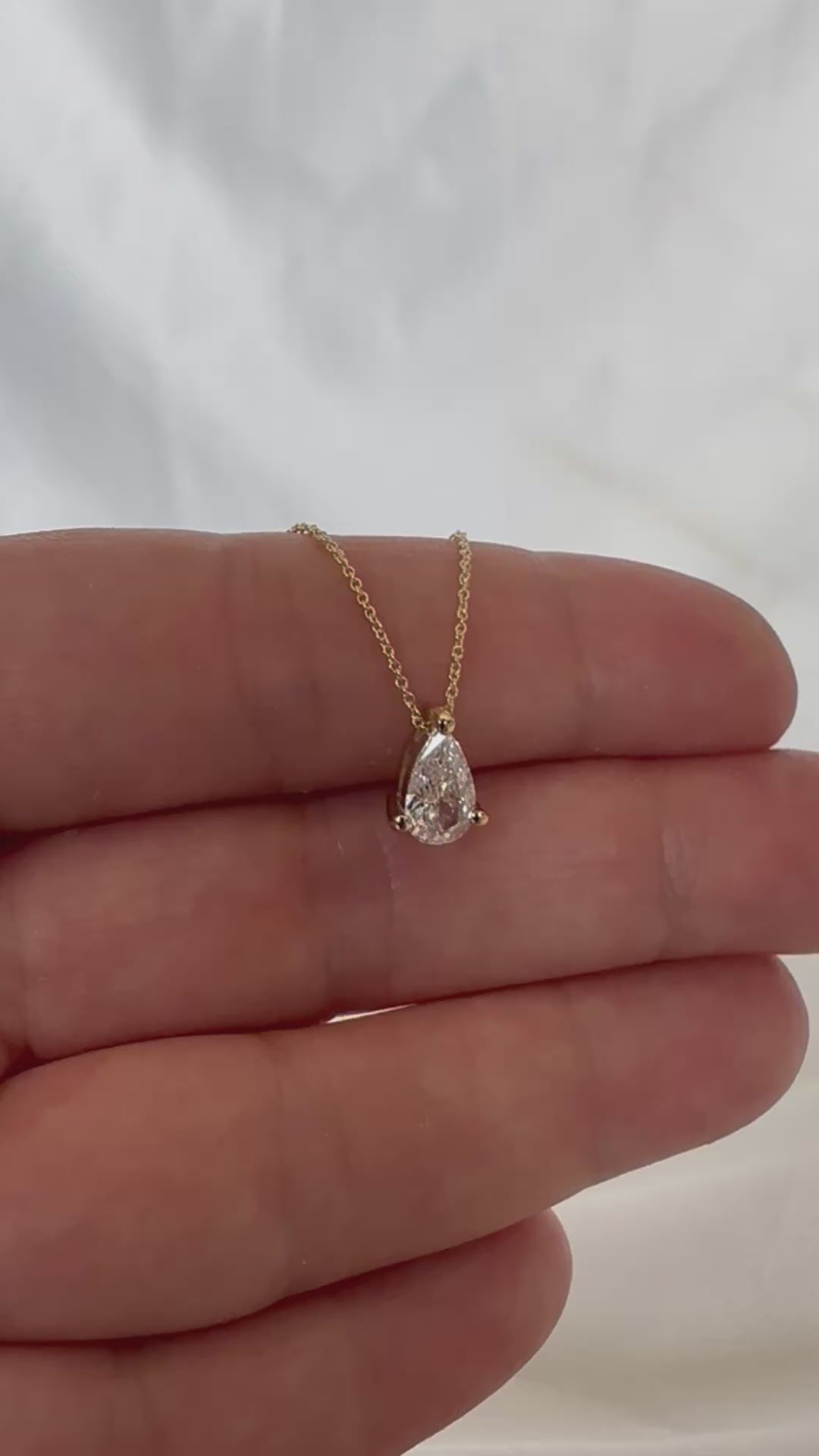 pear diamond necklace 14K gold chain natural diamond pendant
File: pear-diamond-pendant-14k-gold-video-2