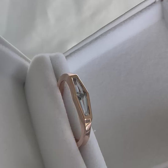 Video of a tapered baguette natural aquamarine two-stone ring in 14K rose gold, rotating to show the stones