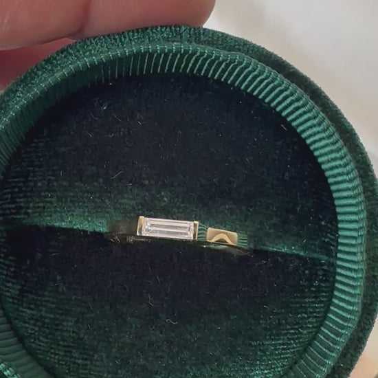 Baguette diamond ring presented in a velvet box