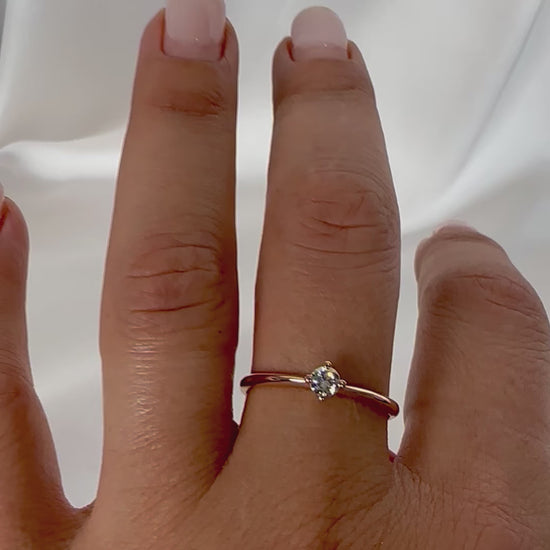 14k rose gold diamond ring shown on womens hand 