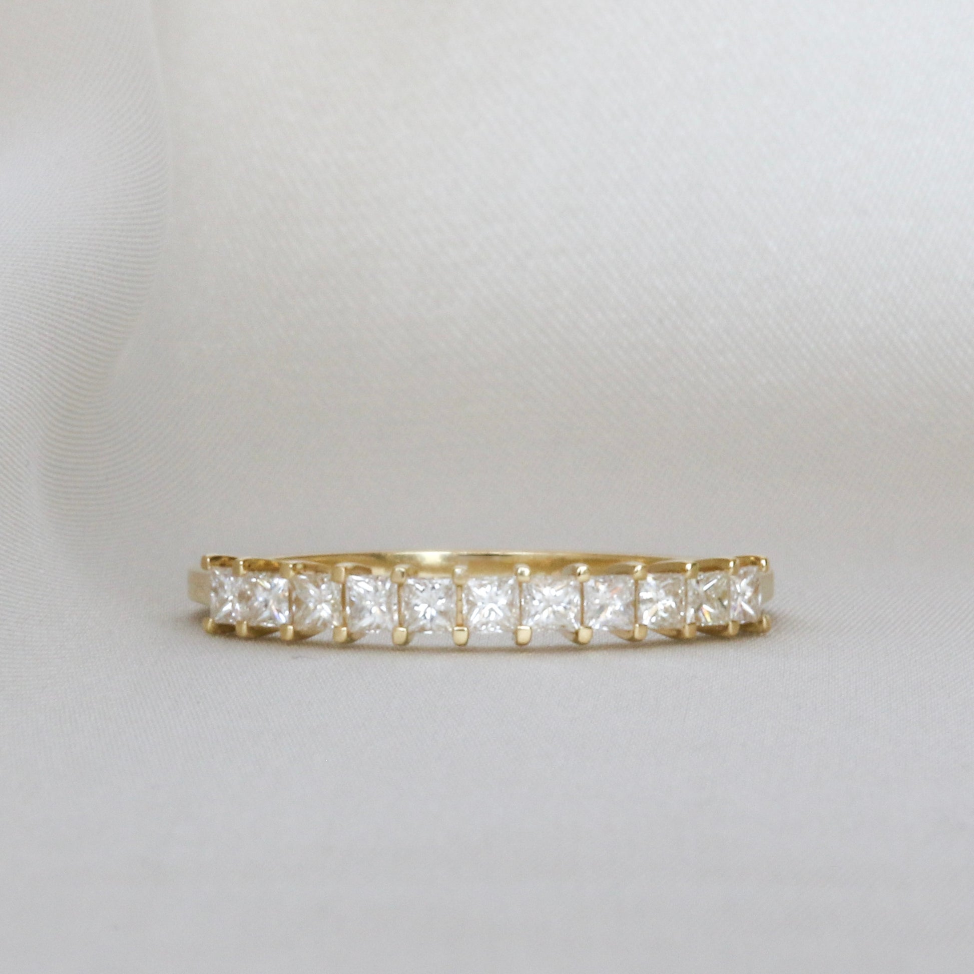 princess cut diamonds in eternity ring made from 14k gold
