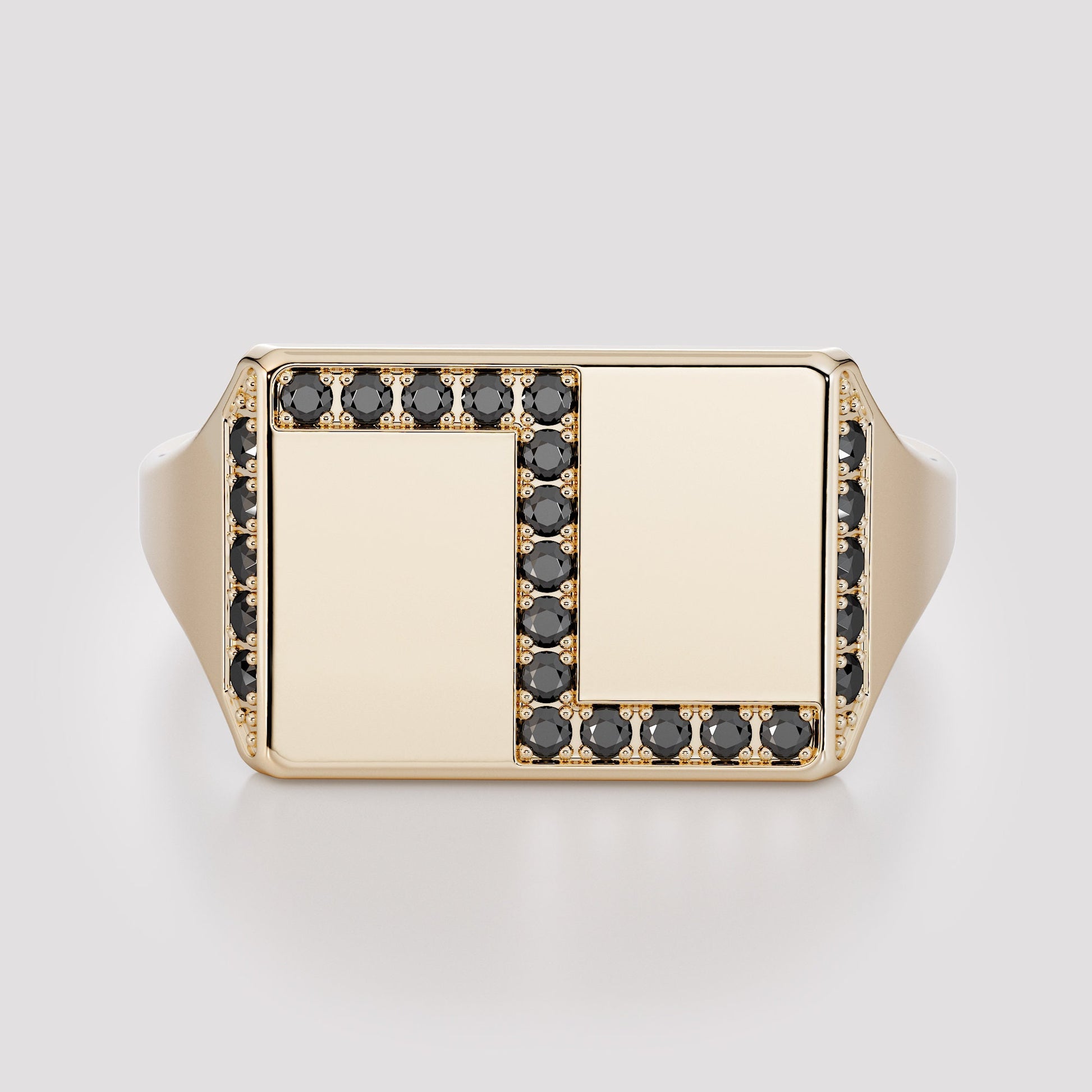 Front view of a rectangular 14K gold signet ring framed with natural black diamonds