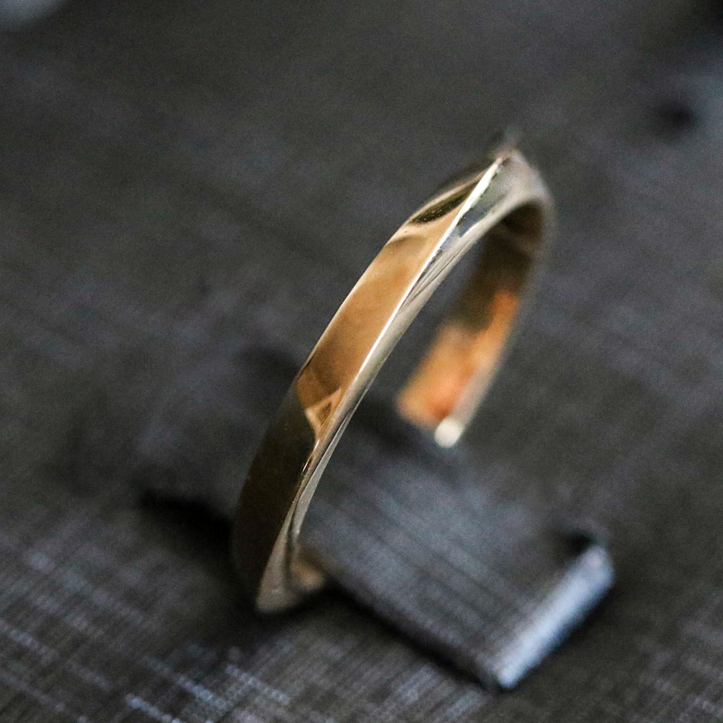 gold geometric ring in box