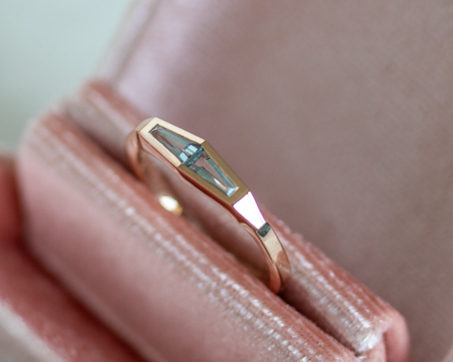 Tapered baguette aquamarine two-stone ring in 14K rose gold, angled view