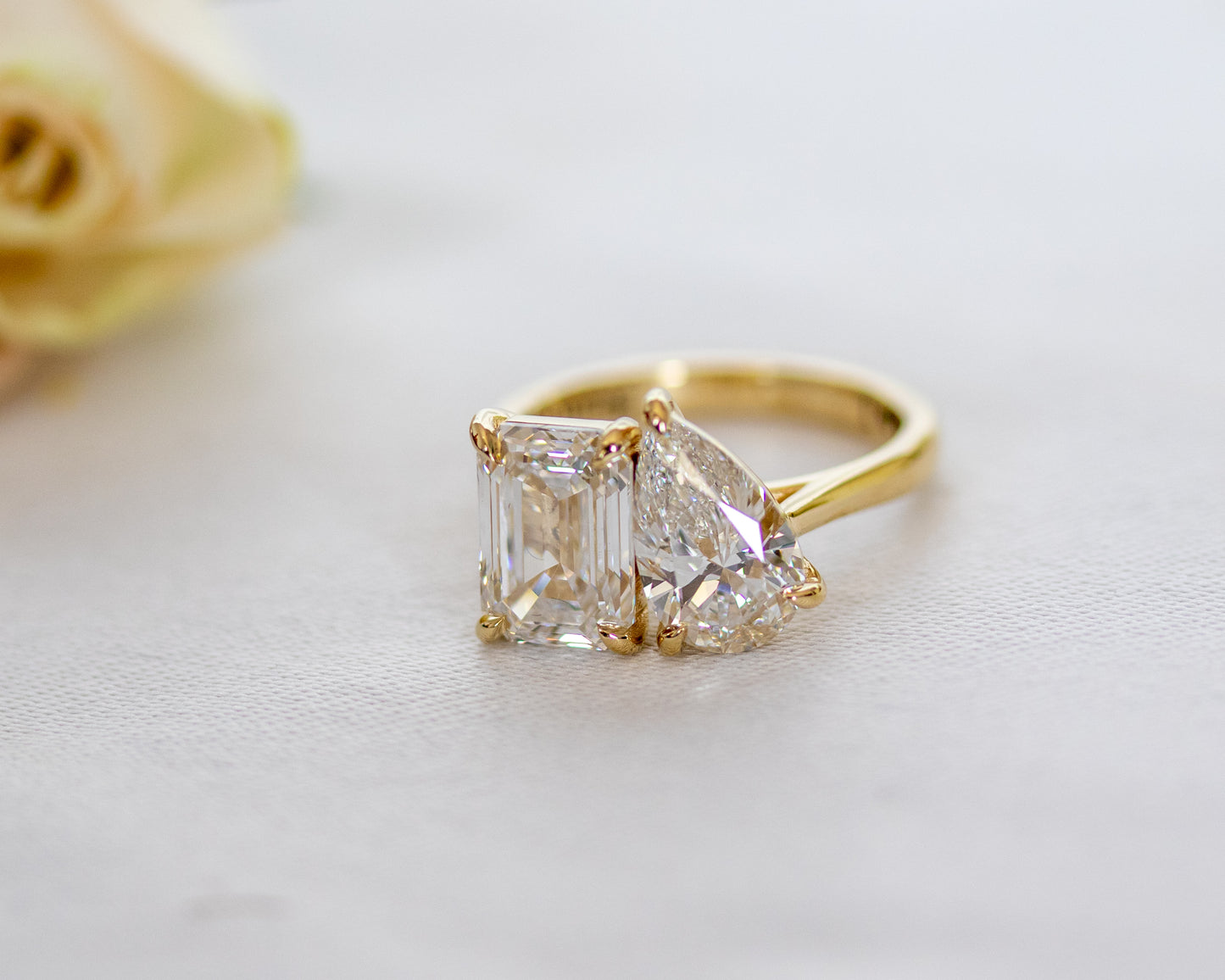 Side view of the Toi et Moi two-stone ring showing the 14K yellow gold band