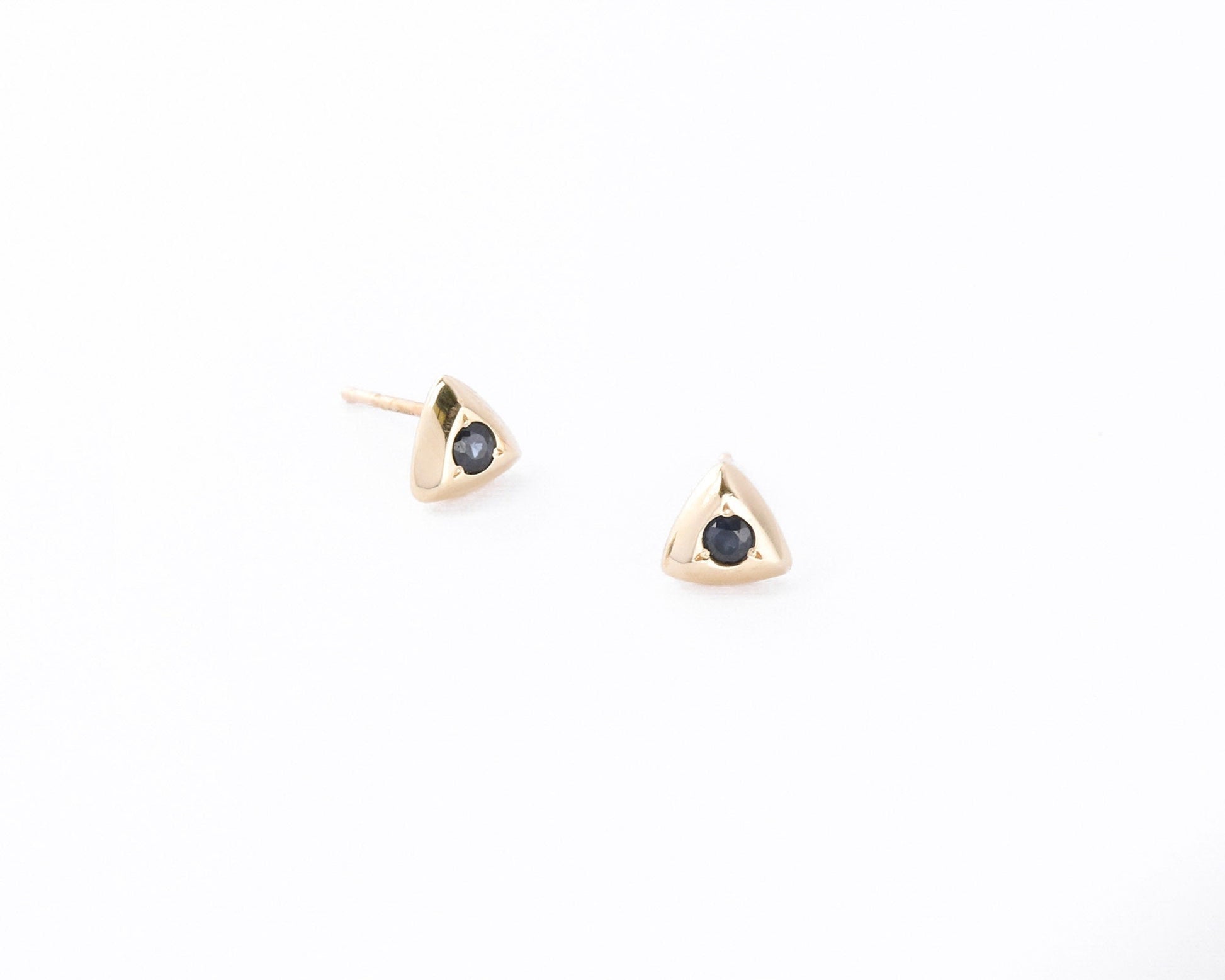 Two 14K gold triangular studs set with round sapphires
