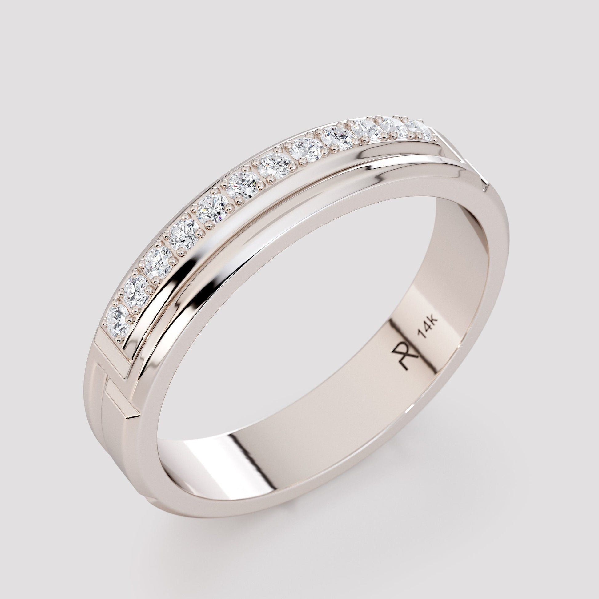 white gold diamond band with engraving detail