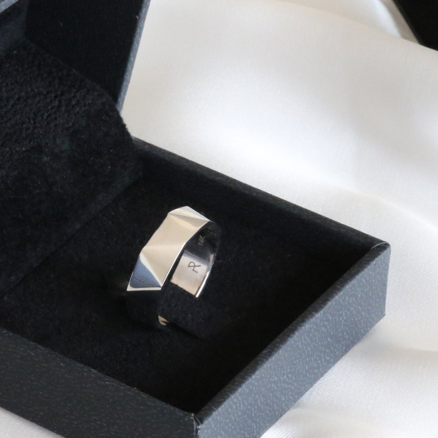 triangle faceted white gold ring in box
