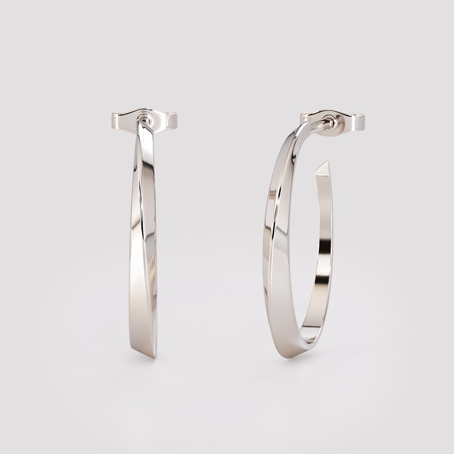 14K white gold twist hoop earrings with sculpted geometric design, modern minimalist fine jewelry photographed on soft gray background.